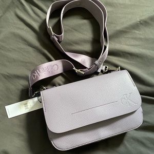 This is a brand new Calvin Klein purse! If you love purple than u will love this